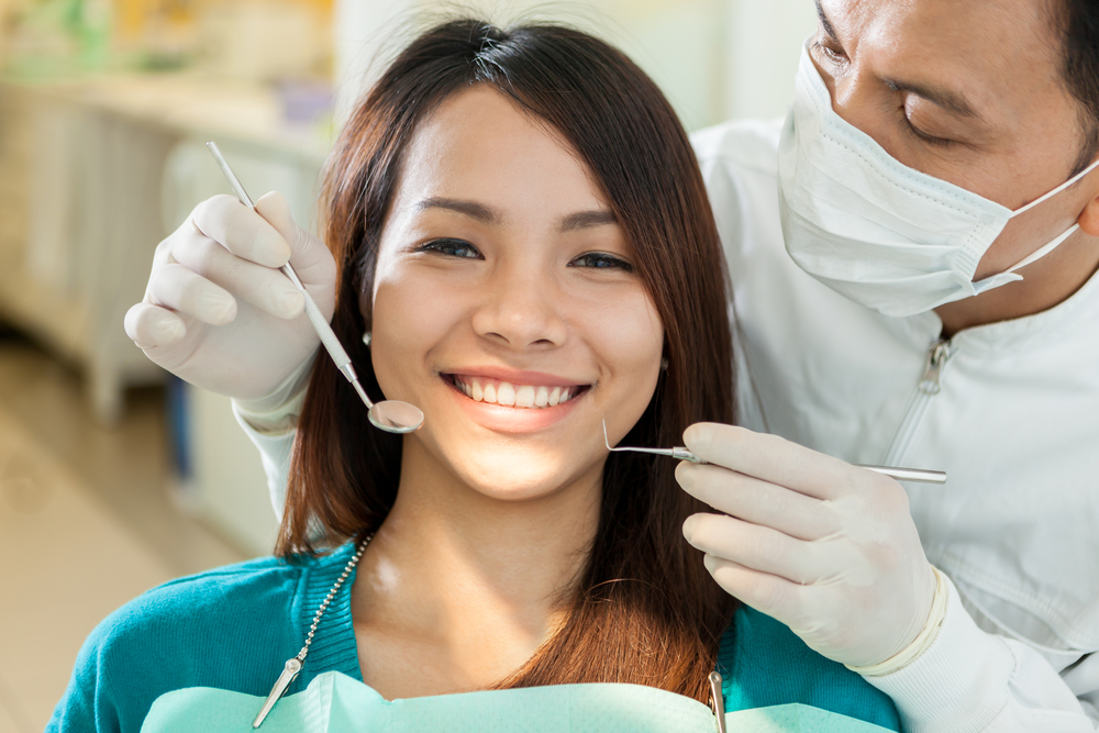 Woman smiling because therapy from Sound to Mountain Dental has reversed the gum disease she was suffering from.