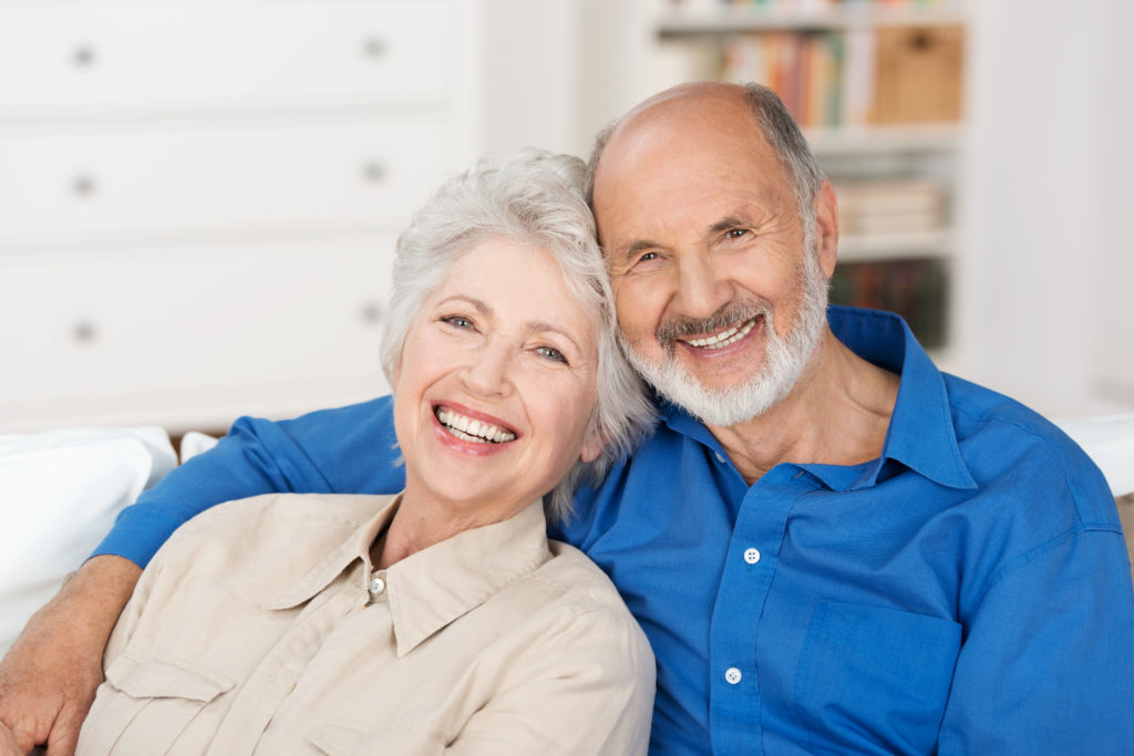 Elderly couple happy with their smile makeovers they received at Sound to Mountain Dental from Dr Hickey in Tacoma, WA. 